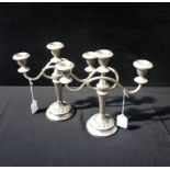 A PAIR OF PLATED CANDELABRA