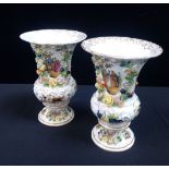 A PAIR OF MEISSEN STYLE PAINTED AND FLOWER ENCRUSTED VASES