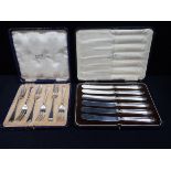 A SET OF SIX GEORGE V SILVER CAKE FORKS