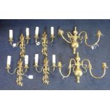 A SET OF FOUR FLAMBEAU STYLE BRASS WALL LIGHTS