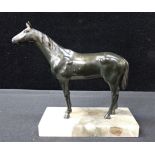 A BRONZE HORSE ON A MARBLE BASE