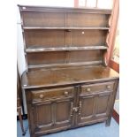 AN ERCOL DARK ELM DRESSER