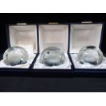 THREE INDIVIDUALLY BOXED ENGRAVED CAITHNESS CHRISTMAS PAPERWEIGHTS