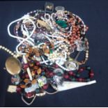 A SMALL QUANTITY OF BEADS AND COSTUME JEWELLERY