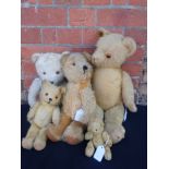 FIVE VINTAGE TEDDY BEARS, THE PALE ONE WITH MUSICAL MOVEMENT