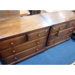A PAIR OF ERCOL STAINED PINE CHESTS OF DRAWERS