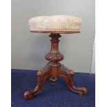 A VICTORIAN WALNUT REVOLVING PIANO STOOL