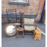 A MODERN EBONISED RUSH-SEATED ROCKING CHAIR