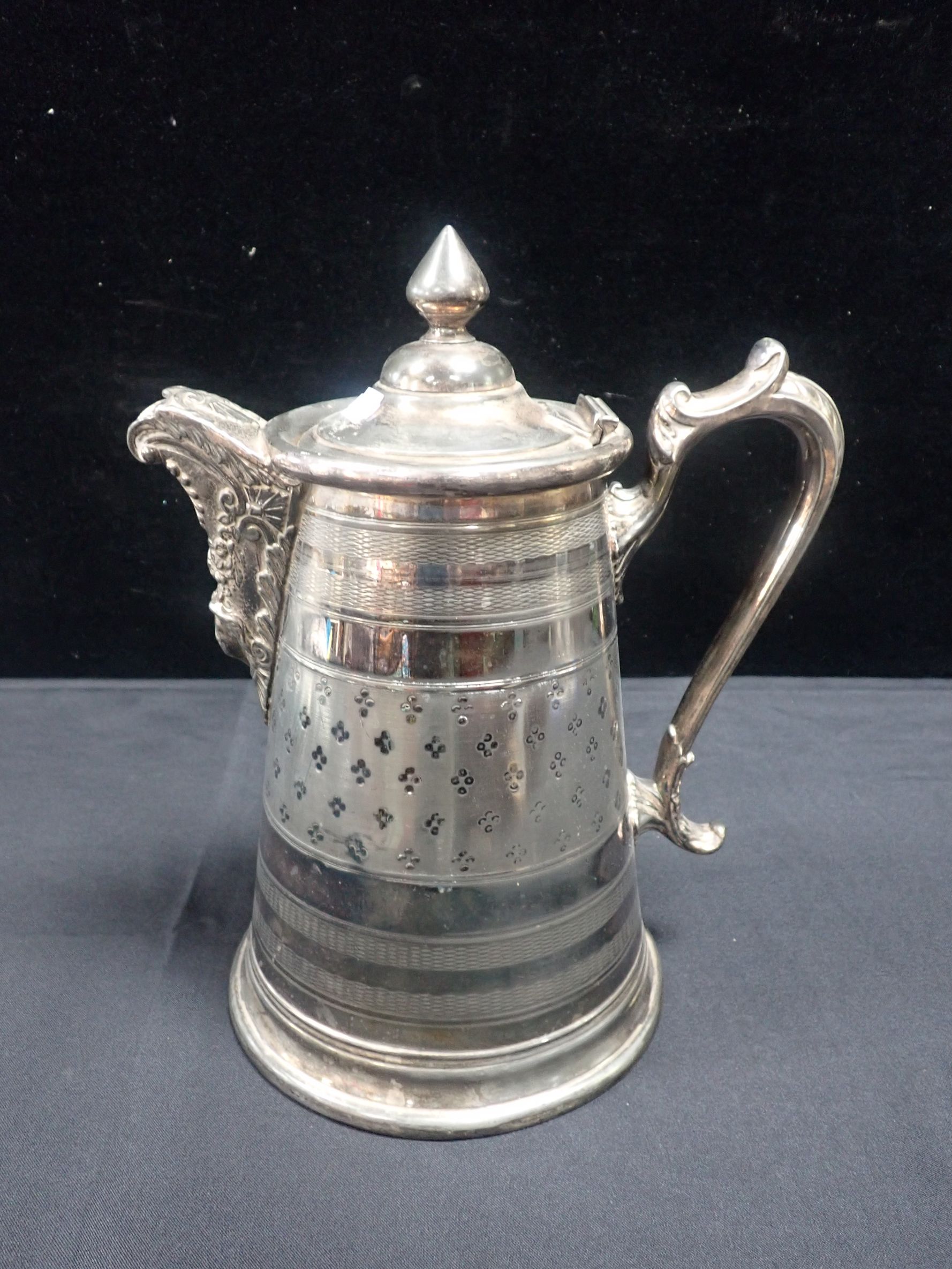 A 19TH CENTURY SILVER PLATED JUG
