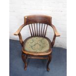 A 1920S STAINED BEECH OFFICE ARMCHAIR