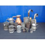 A COLLECTION OF PEWTER MEASURES