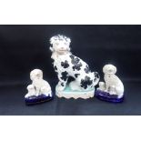 TWO SIMILAR STAFFORDSHIRE POODLE ORNAMENTS