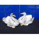 A PAIR OF MEISSEN STYLE PORCELAIN SWANS