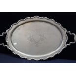 A SILVER-PLATED TRAY WITH ENGRAVED VACANT SHIELD