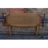 AN ERCOL CANED DOUBLE BEDHEAD