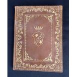 A VINTAGE ITALIAN LEATHER-BOUND NOTEBOOK, WITH GILT ARMORIAL