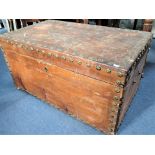 A LARGE 19TH CENTURY TRUNK WITH BRASS ROSETTE STUDS