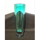 A TALL HEAVY GREEN GLASS CYLINDRICAL VASE