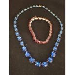 A VINTAGE COSTUME NECKLACE WITH GRADUATED BLUE 'STONES'