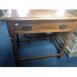 AN EDWARDIAN OAK SIDE TABLE