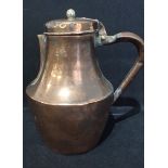 A COPPER JUG WITH HINGED LID