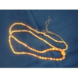 A BUTTER AMBER NECKLACE