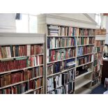 A LARGE BREAKFRONT OPEN BOOKCASE