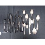 A COLLECTION OF SILVER SPOONS AND TONGS