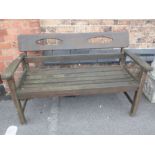 A WEATHERED GARDEN BENCH