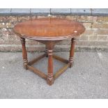 AN OAK AND WALNUT CIRCULAR OCCASIONAL TABLE