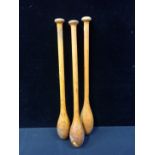 A SET OF THREE TURNED WOOD ' INDIAN CLUBS'