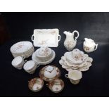 THREE NORITAKE CABINET CUPS AND SAUCERS, PAINTED AND GILT