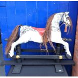 A WOODEN 'SAFETY' TYPE ROCKING HORSE