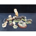 A COLLECTION OF ANIMAL AND BIRD FIGURES