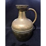 A VICTORIAN BRASS JUG BY HENRY FEARNCOMBE
