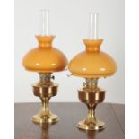 A PAIR OF 20TH CENTURY ALADDIN BRASS TABLE OIL LAMPS