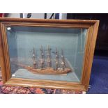 A MODEL SAILING SHIP DIORAMA