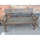 A WEATHERED GARDEN BENCH