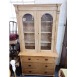 A 19TH CENTURY STRIPPED PINE BOOKCASE