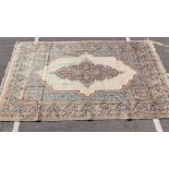 A LARGE CREAM GROUND TABRIZ STYLE RUG WITH CENTRAL MEDALLION