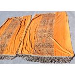 A PAIR OF BURNT ORANGE VELVET CURTAINS, WITH CENTRAL FIGURED PANELS