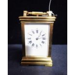 A BRASS-CASED FRENCH CARRIAGE CLOCK