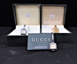 TWO WHITE METAL AND ONE YELLOW METAL GUCCI WATCHES