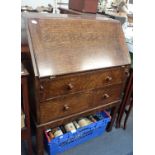 A SMALL 1920S OAK BUREAU