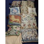 A COLLECTION OF NEEDLEPOINT CUSHIONS