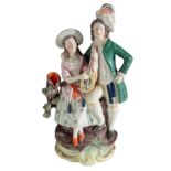 A VICTORIAN STAFFORDSHIRE POTTERY SPILL VASE, MUSICIANS
