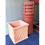 A SQUARE TERRACOTTA LATTICE PATTERN GARDEN PLANTER