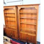 A PAIR OF CHERRYWOOD OPEN BOOKCASES