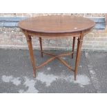 AN EDWARDIAN MAHOGANY OVAL WINDOW TABLE