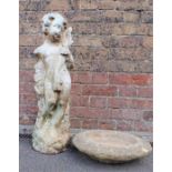 A RECONSTITUTED STONE GARDEN FIGURE